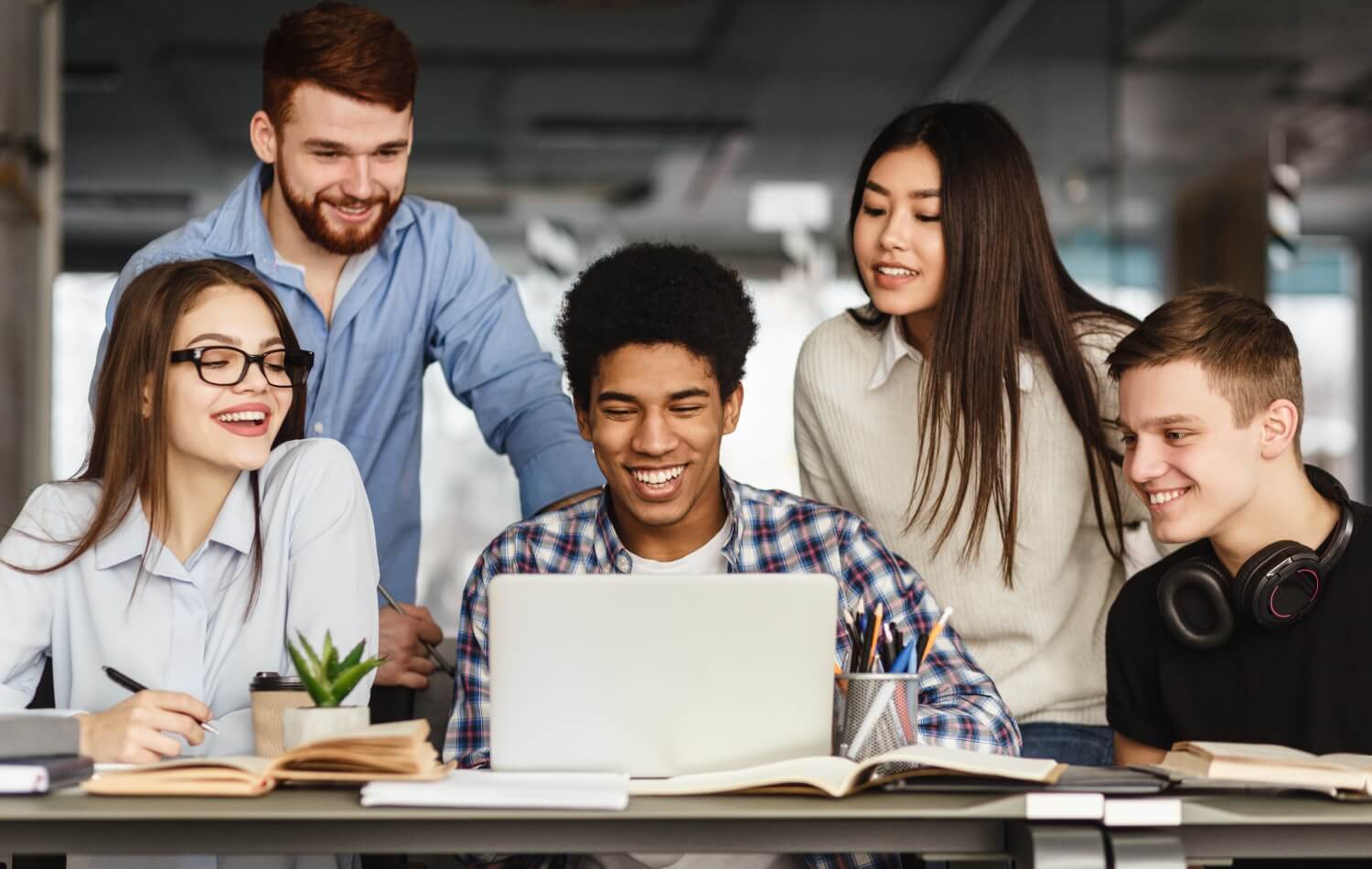 Students working at a laptop
