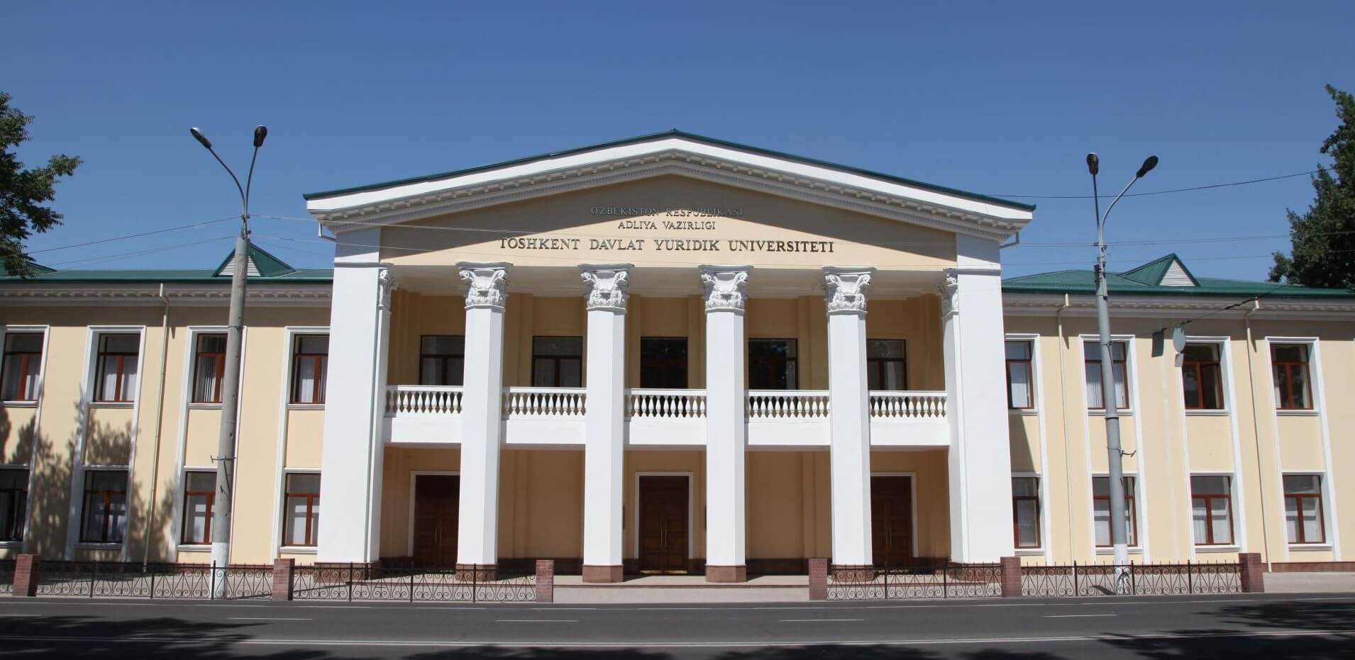Tashkent State University of Law students throwing graduation caps
