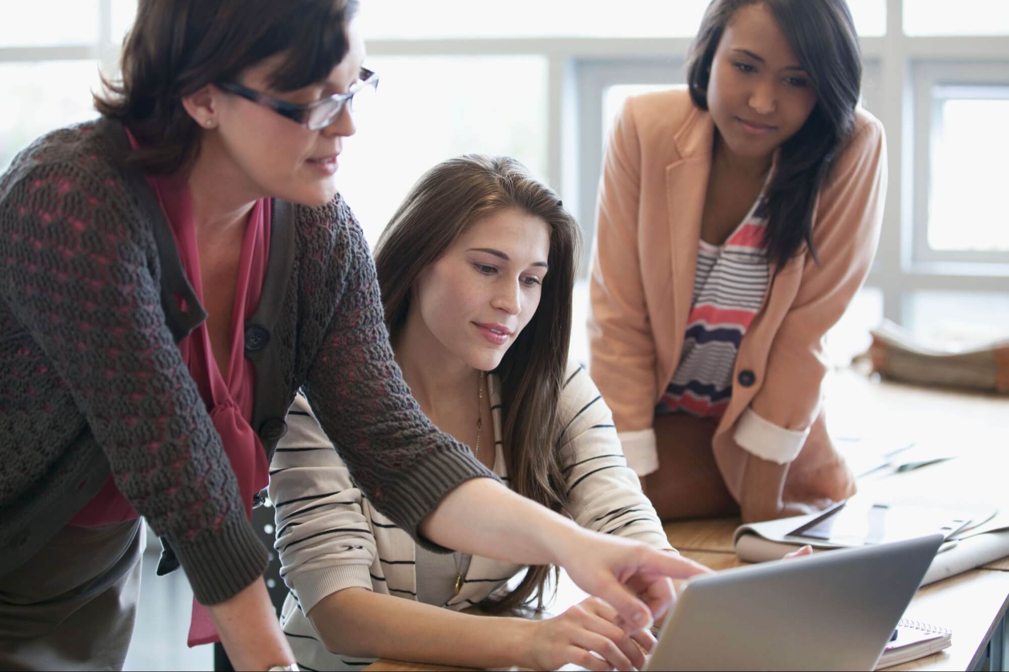 A group of please working together in a library