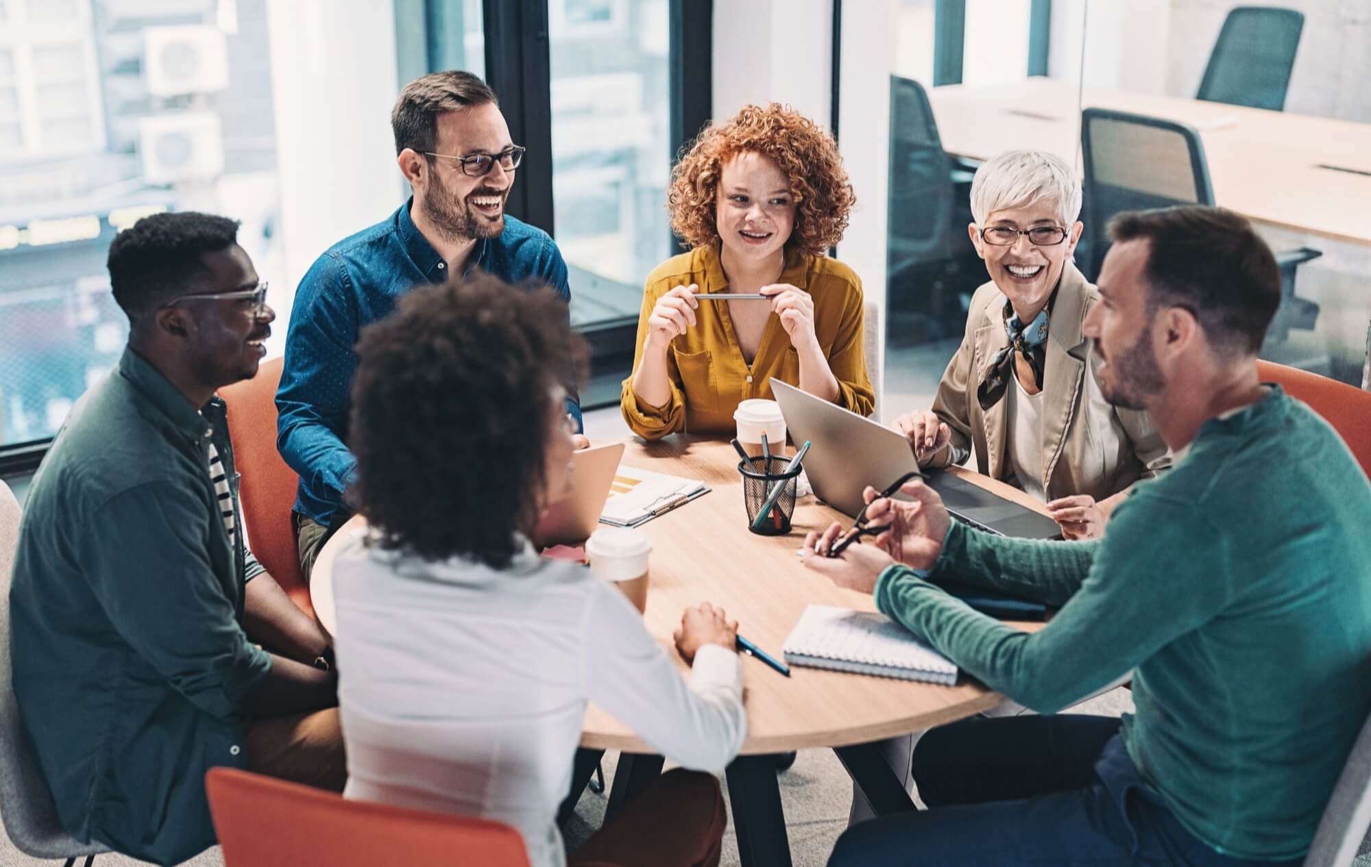 A group of people sitting around a table
