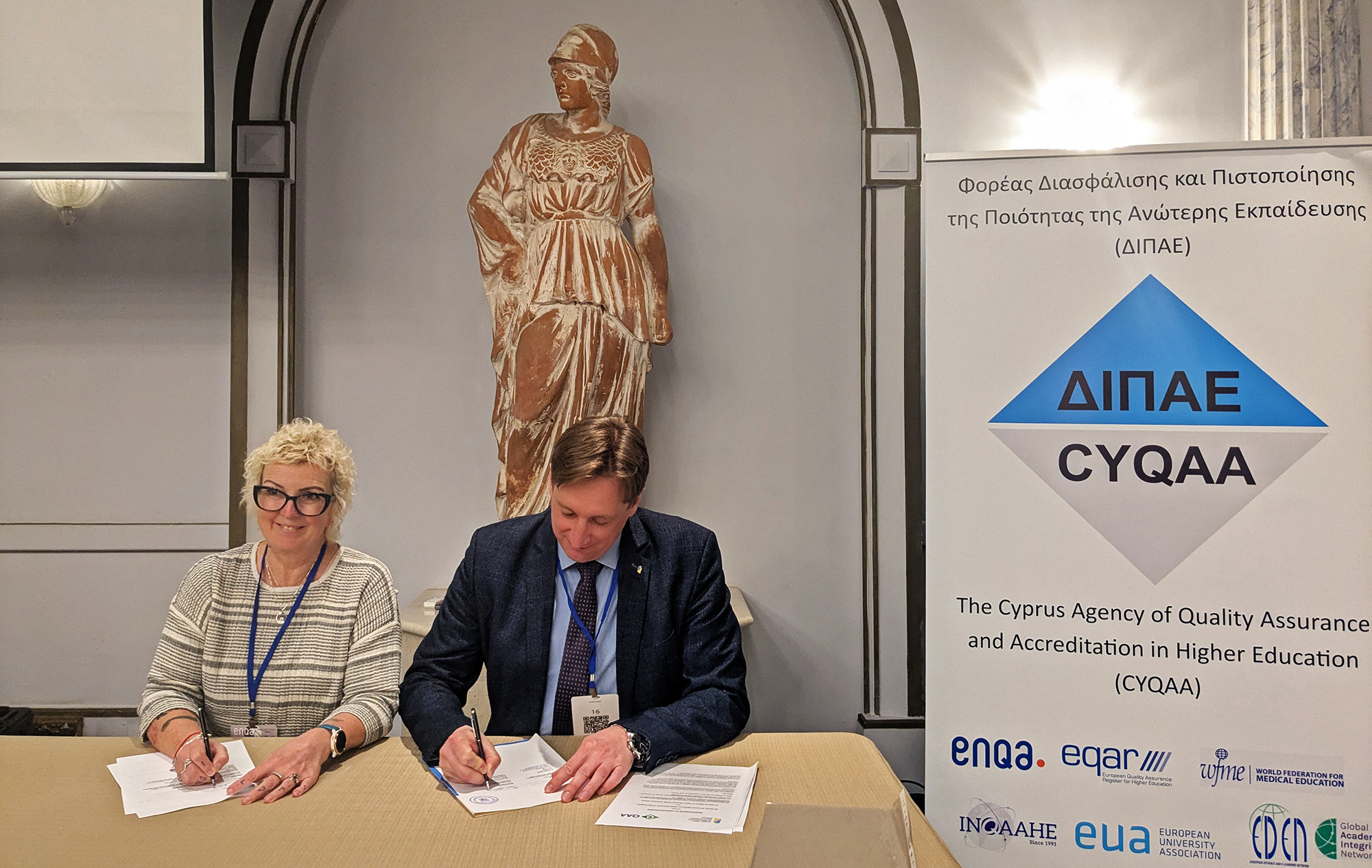 Vicki signing an MoU with NAQA